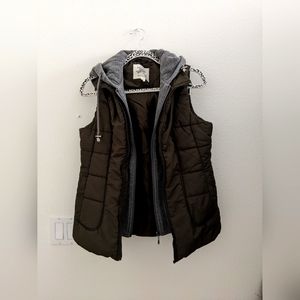 Cute, warm and stylish green vest - with sewn in gray hood and inner zipper!